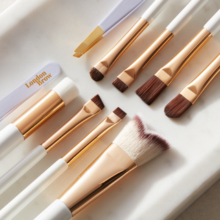 MUA Make up brushes laid out on a try from the london brow company