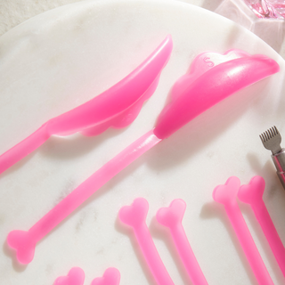Pink silicone lash lift shield on a white surface background