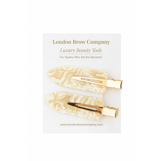 Gold hair clips on a card with 'London Brow Company' branding on a white background