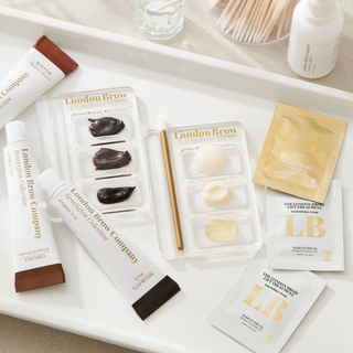 Skincare products from the London Brow Company on a white tray.