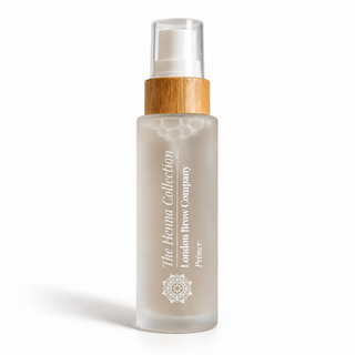 Clear glass bottle of london brow henna primer for preparing eyebrow henna and eyebrow tinting