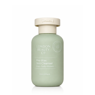 Green bottle of London Beauty Co Pre-Wax Skin Cleanser on a white background