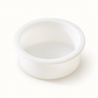 A small white silicone insert bowl with a wide rim, photographed on a seamless white background.