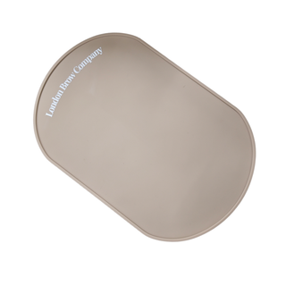 Beige salon silicone pad with 'London Paw Company' branding on a white background