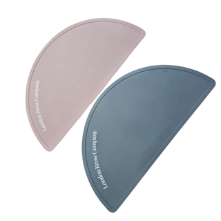 Two curved silicone pads, one pink and one blue, on a white background.