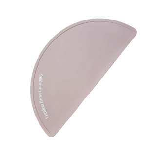 Cosmetic silicone mat with 'London Brow Company' branding on a white background