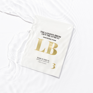 White saschet with gold text and branding on a white background